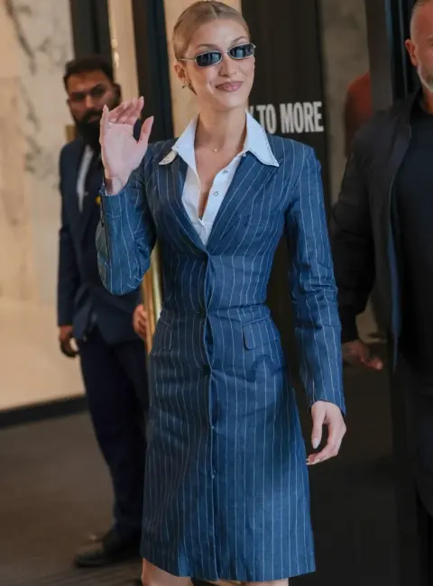 Fashion Icon: Bella Hadid Stuns in Pinstriped Dress and Floral Hairpiece at Selfridges Launch Event 05-18-25