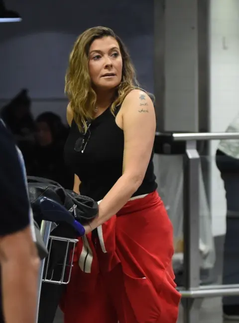 Kym Marsh Receives Heartwarming Welcome from Loved Ones at Manchester Airport 08-24-2025